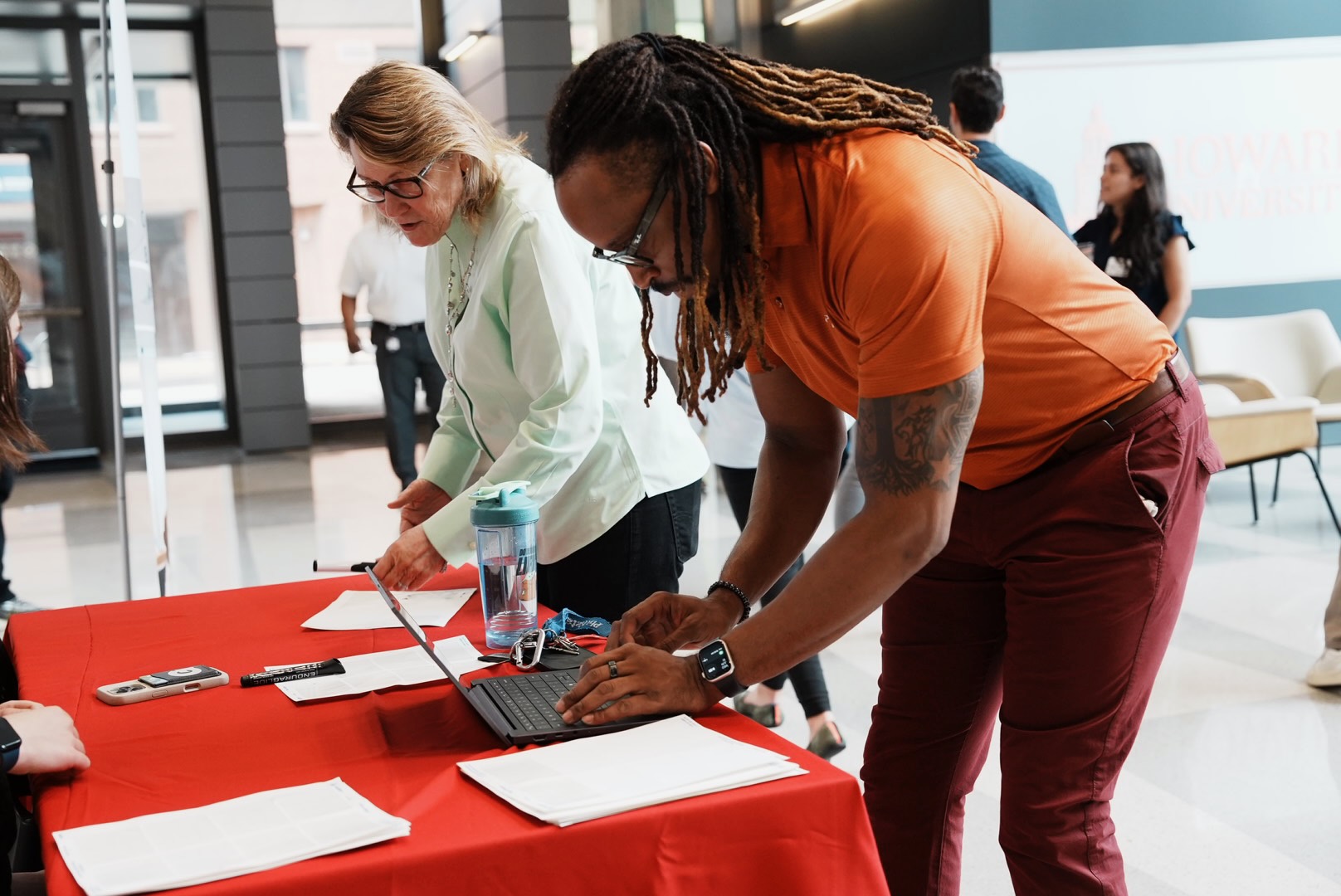An attendee checks in at the Howard Hospital trade contractor outreach event