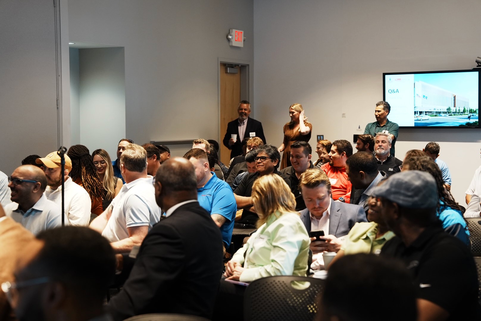 A full room of contractors and suppliers during the outreach presentation