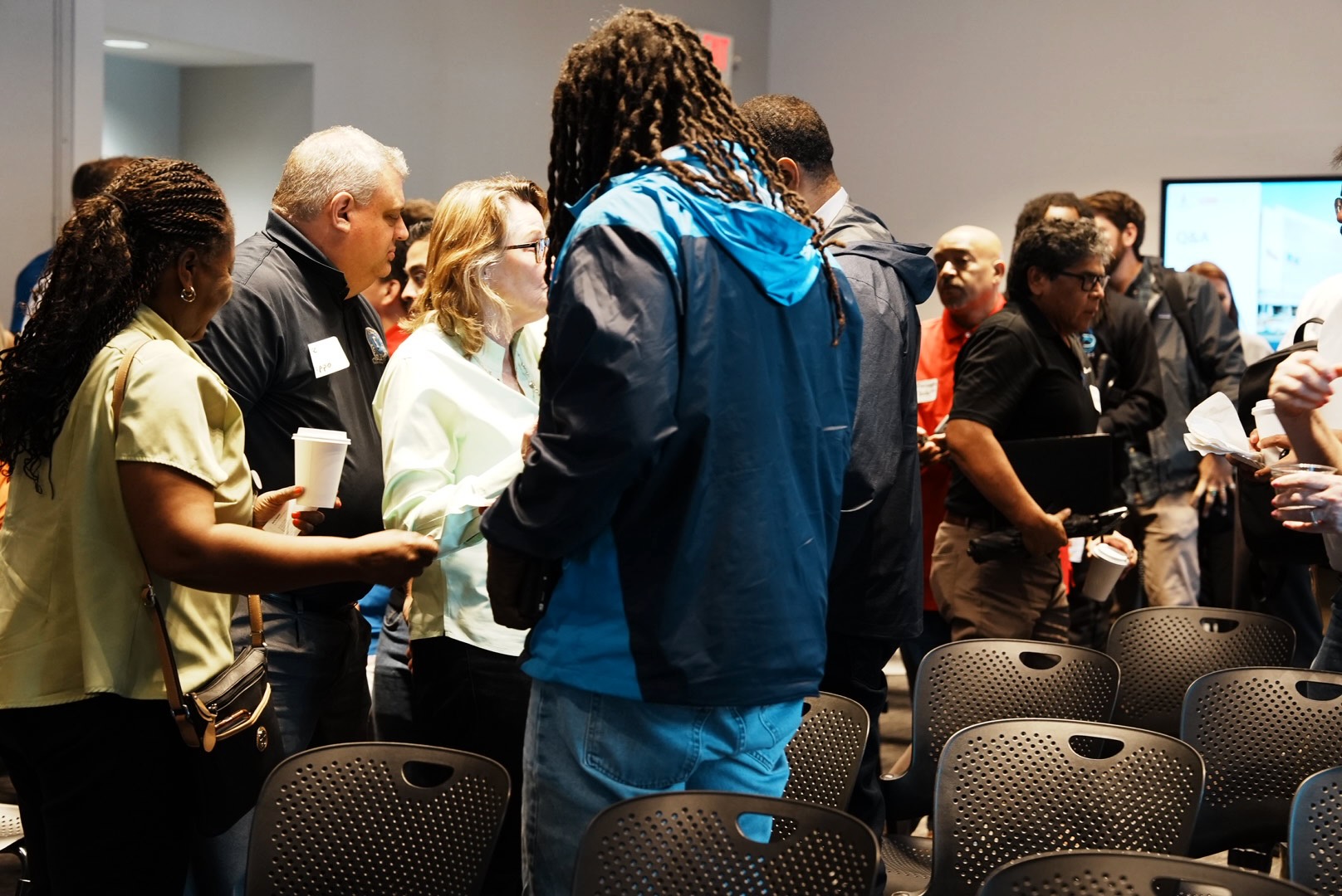 Contractors and project representatives network after the presentation