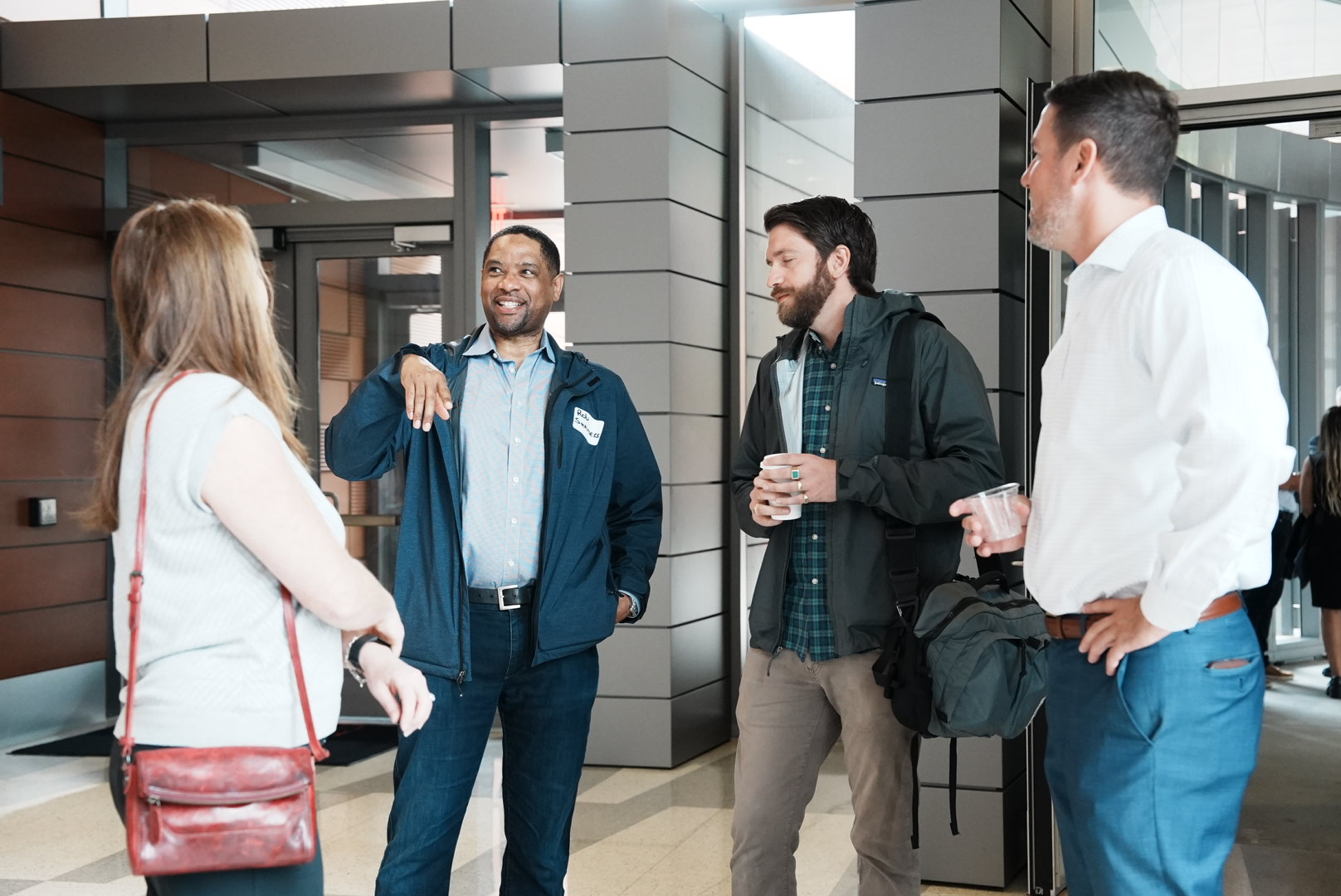 Trade contractors and project representatives continue a conversation during the outreach event