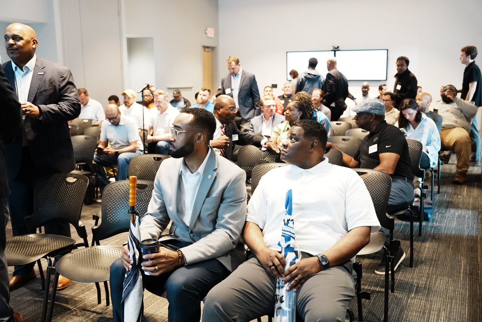 Contractors and project representatives seated before the Howard Hospital trade contractor outreach presentation